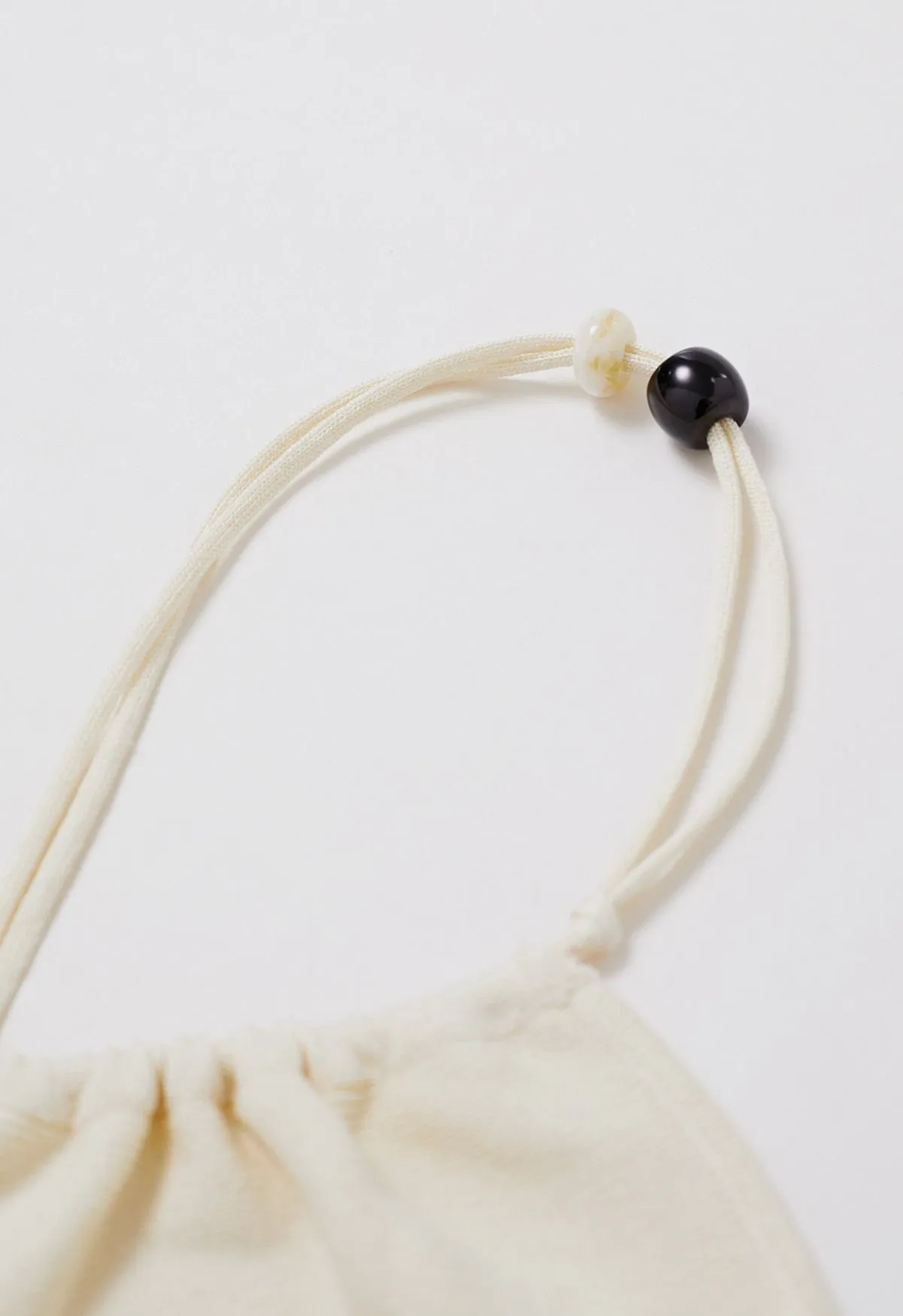 Haut en tricot perlé à une épaule en crème