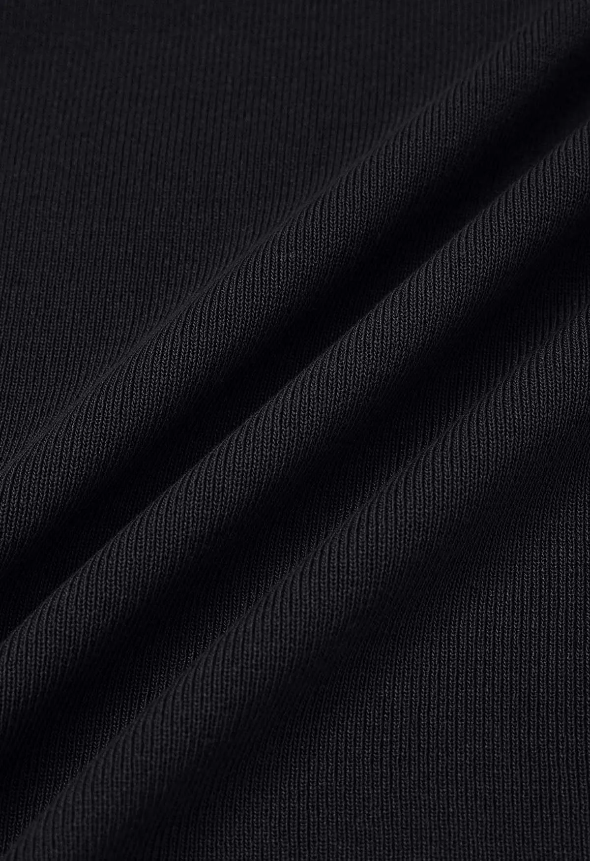 Haut en tricot à manches longues et découpes aux épaules nouées en noir